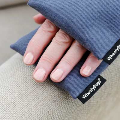 Wheat Bags Small Rectangle Heat Pack - Pack of 2 in Gothic Blue  Luxury Cotton Fabric Being Shown In Use